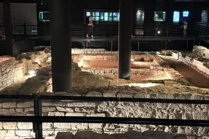 The temple is in the basement of the shopping mall that was built around and above it. It's a free museum.